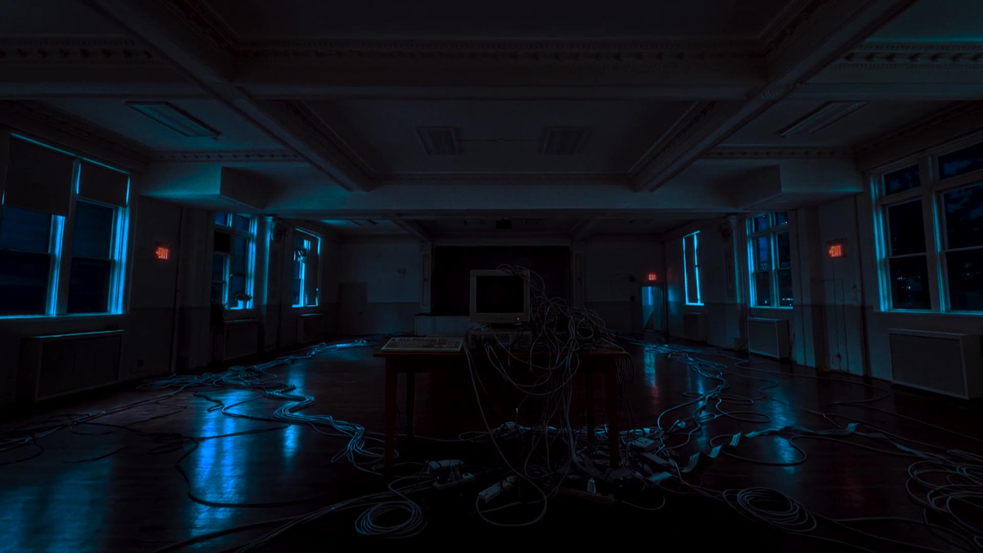 A cyan-lit hall at the school